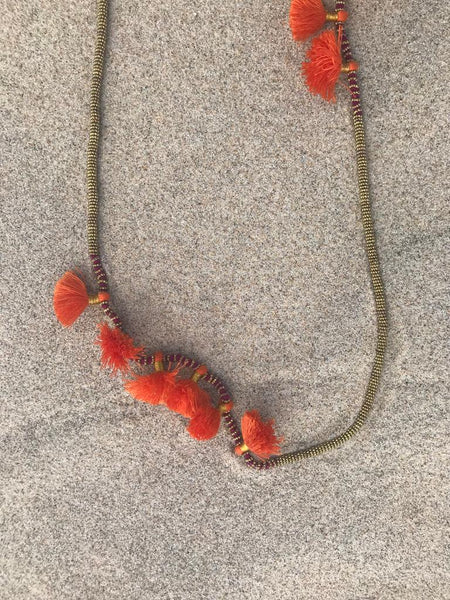 DEEP RED ROPE NECKLACE TRIMMED IN LIGHT GOLD BEADS WITH CORAL FRINGE DETAIL