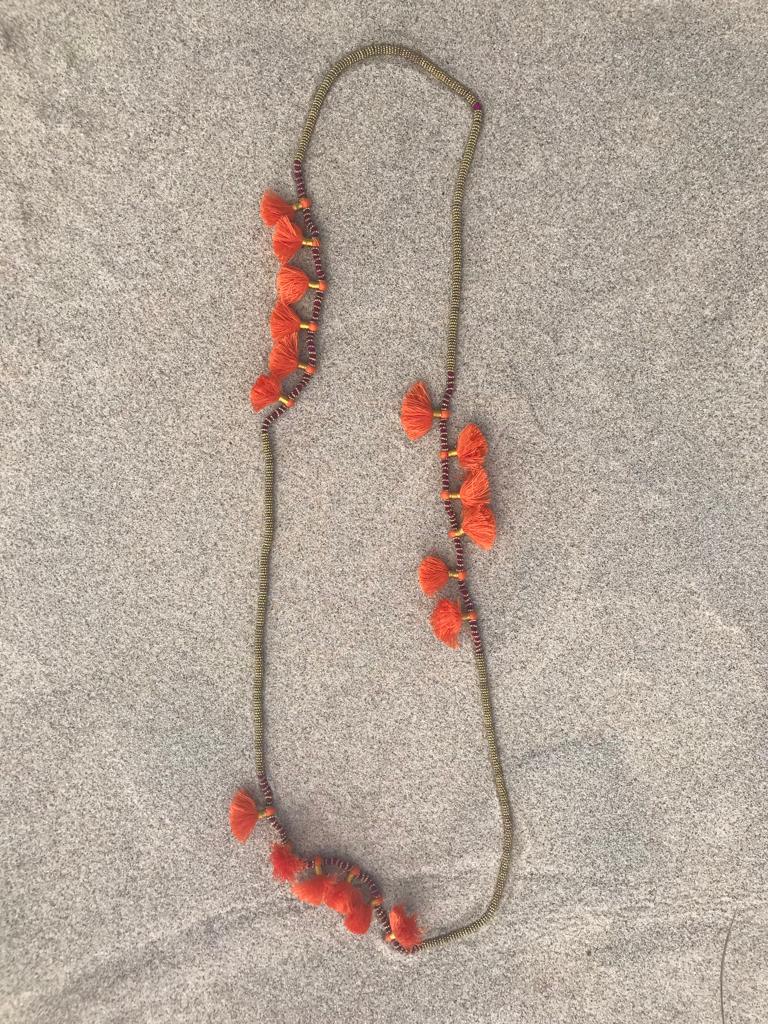 DEEP RED ROPE NECKLACE TRIMMED IN LIGHT GOLD BEADS WITH CORAL FRINGE DETAIL